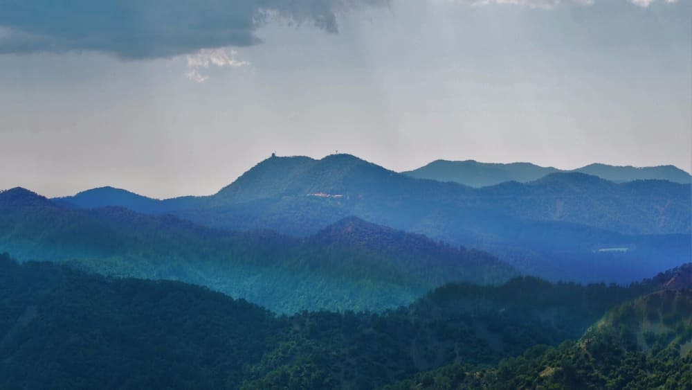 A mountain range with a misty atmosphere.