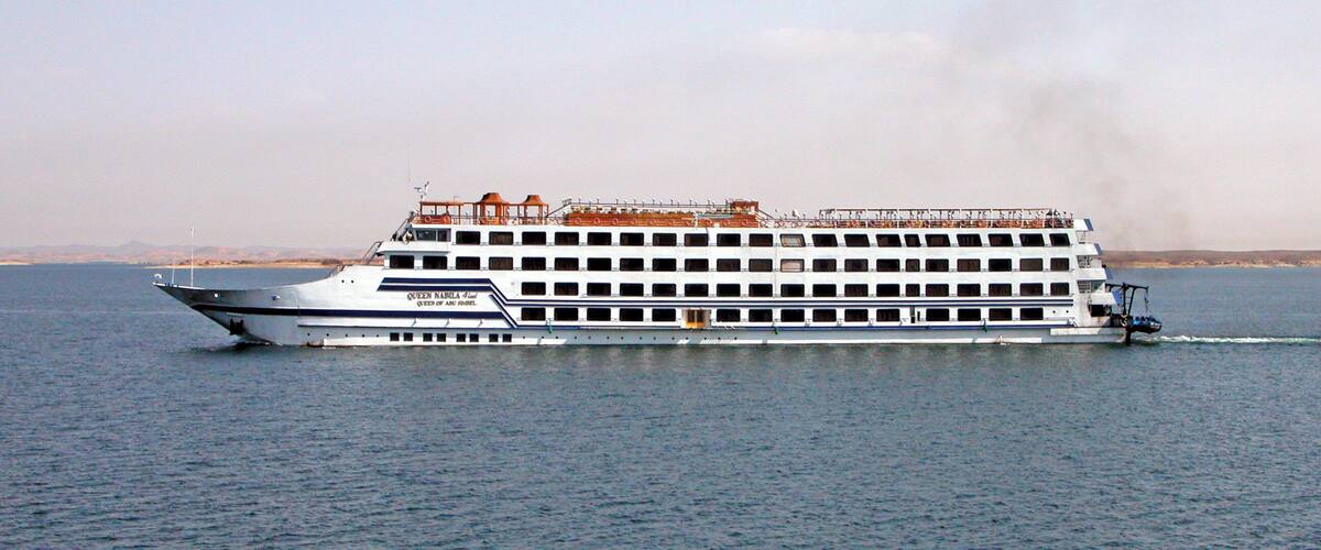 A large cruise ship named 'Queen Mary 2' on the water.