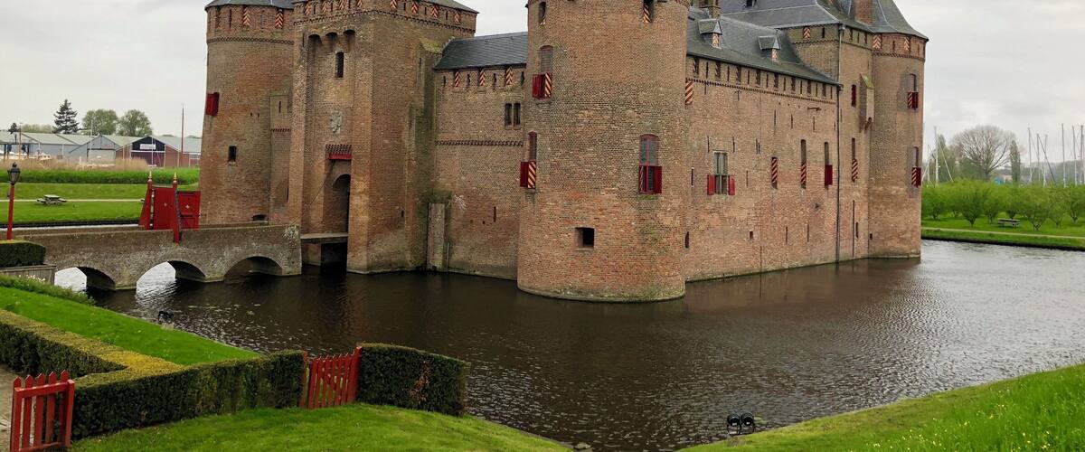 A historic castle with multiple towers and a moat.