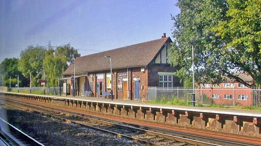 Byfleet & New Haw station, Up Slow line platform. View westward, taken from a Down train, towards Woking and the West: ex-LSWR Waterloo - Woking and the West main line. Station was 'West Weybridge' until 12/6/61.