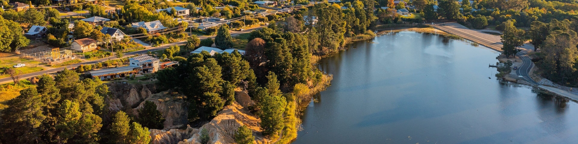 Beechworth which includes a sunset, a small town or village and a lake or waterhole