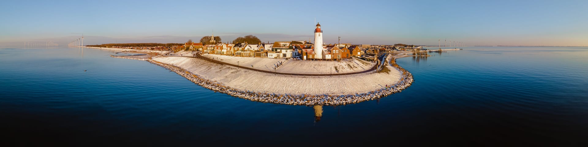 Lighthouse of Urk during winter with snow cold weather in the Netherlands.