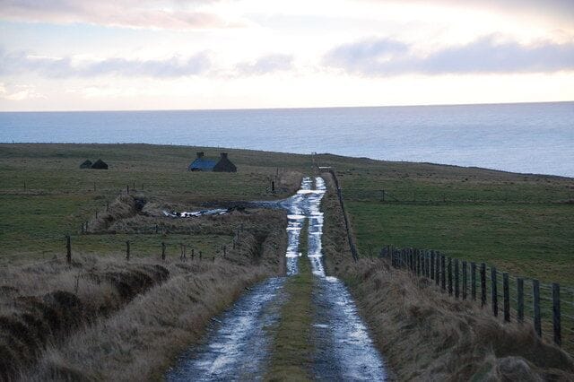 Rough track, rough grazing, derelict crofthouse At the bottom of Ward Hill, looking southeast along the rough track. Just after the photo was taken, a shower of sleet reduced visibility to a few metres.