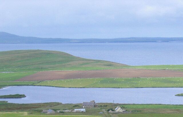 Wasbister Loch on Rousay. Wasbister Loch on the north of Rousay (Orkney)looking over to Westray. At the left hand side of the loch can be seen The Burrian - believed to be a 'crannog' or artificial island.