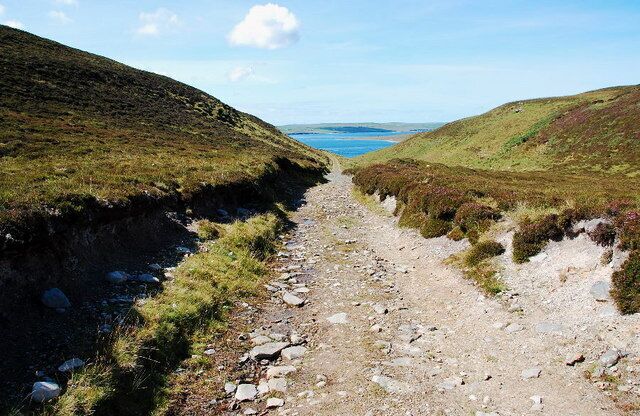 The track back Looking towards Eynhallow Sound, Eynhallow to the right and Mainland (as in Mainland Orkney) beyond.