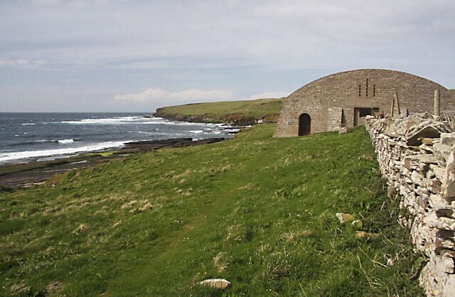 Mid Howe chambered cairn, near to Westness, Orkney Islands, Great Britain. The shed has been built by Historic Scotland to protect the chambered cairn of Mid Howe. The doorway to the left provides free access at all times.