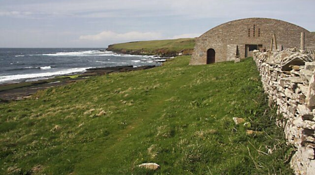 Mid Howe chambered cairn, near to Westness, Orkney Islands, Great Britain. The shed has been built by Historic Scotland to protect the chambered cairn of Mid Howe. The doorway to the left provides free access at all times.
