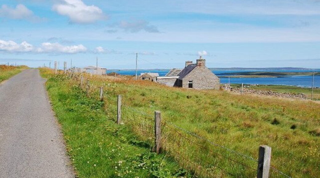 Lane near Brendale On a glorious day. Egilsay in the middle distance with the Holm of Scockness in front. Eday on the horizon.