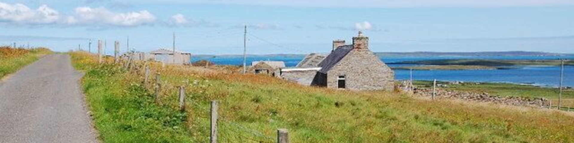 Lane near Brendale On a glorious day. Egilsay in the middle distance with the Holm of Scockness in front. Eday on the horizon.