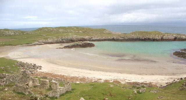 Sorisdale Bay, Coll The bay at the end of the road in the north east of Coll, viewed from high ground to the south west of it. Also seen is one of a number of ruined buildings in the area surrounding the bay.