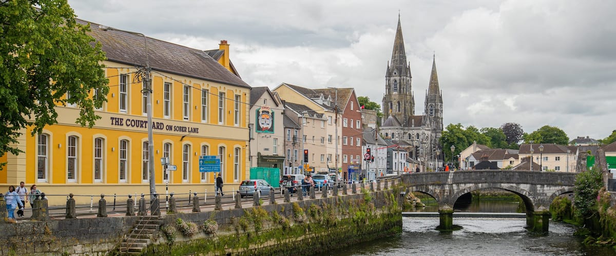 Cork City Centre showing a river or creek, a city and a bridge