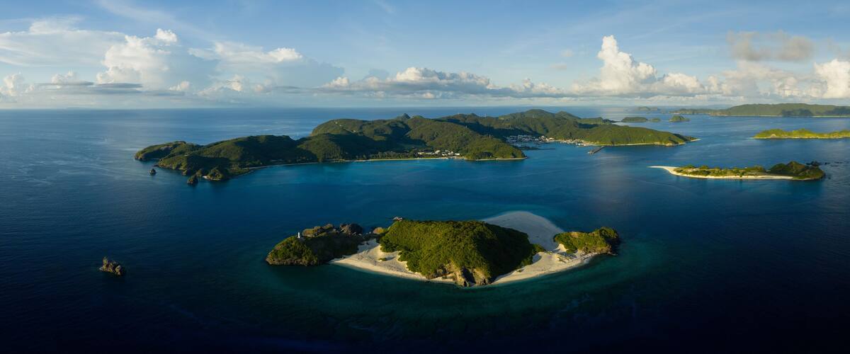 A tropical archipelago with lush green islands and clear turquoise waters.