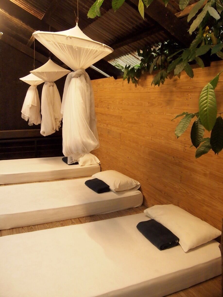 SeKEPING SERENDAH - Warehouse 1 , this is our sleeping Area elevated from the Ground Floor and open to Nature - such a unique experience that im sleeping next to tree protruding next to my Bed