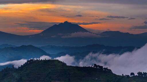 #Goldenhour view of the Virungas. In the distance is Nyaragongo Volcano, but I was safely in Uganda when I took the photo. #Gorillas