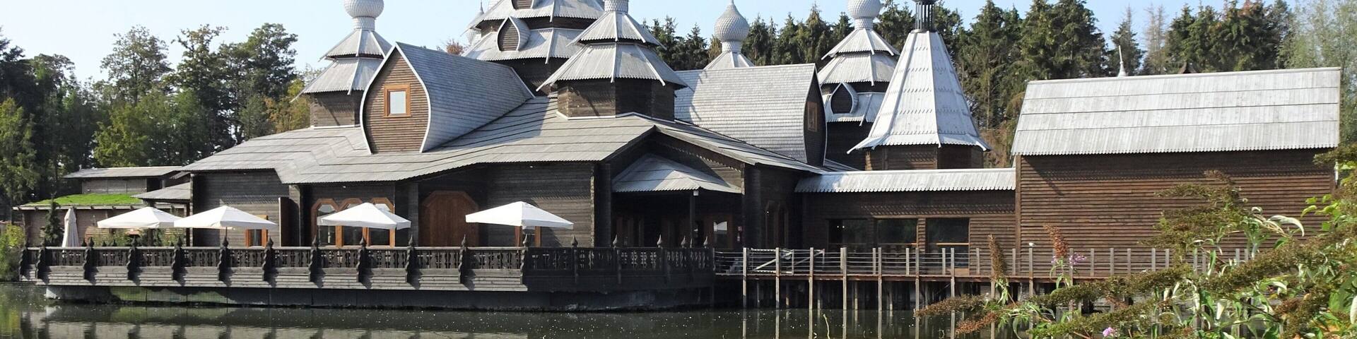 Pairi Daiza is a big animal park, located on the site of the former Abbey of Cambron, where visitors make a trip along the 5 continents and discover more than 5,000 animals. In May 2018 Pairi Daiza received the prize for âBest animal park in Europeâ at the presentation of the Diamond Theme Park Awards, also known as the Oscars of the theme parks and zoos.
The photo shows Restaurant The Izba.
Izba (Озба) means in Russian: wooden house in the countryside. The Izba in Pairi Daiza is inspired by traditional Russian architecture, with its roof tiles and domes, which are also made entirely of wood! It is an immense restaurant (1.100 mÂČ covered and a terrace of 400 mÂČ) with a cosy atmosphere and the decoration refers to fairy tales and legends from Russian folklore.