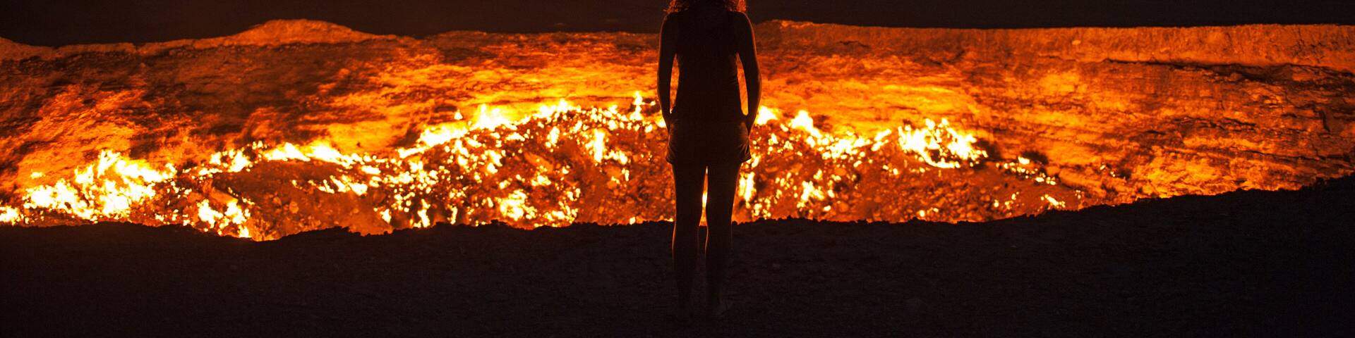 Darvaza, Turkmenistan - Staring into the flaming gas crater known as the Door to Hell In Darvaza, Turkmenistan.