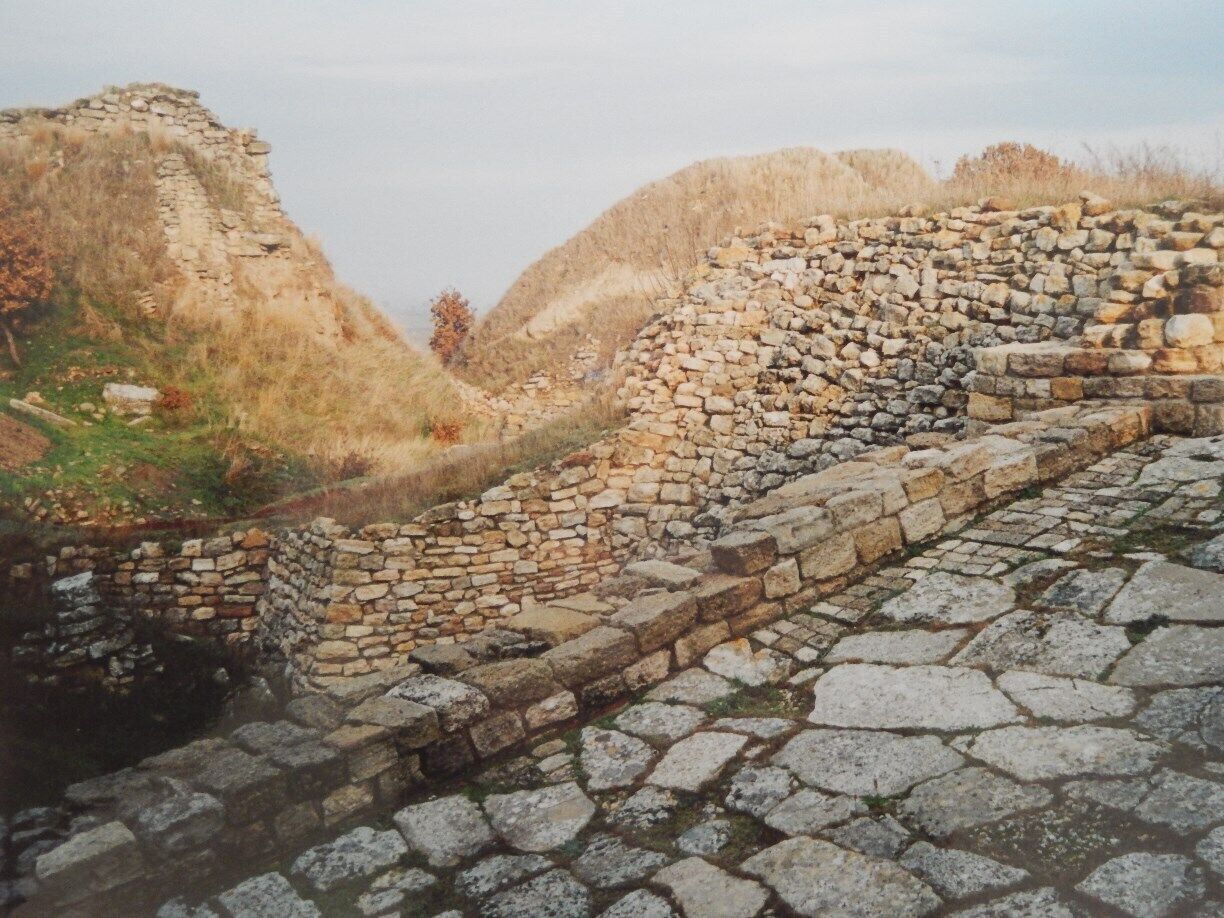 An ancient stone wall with a pathway.