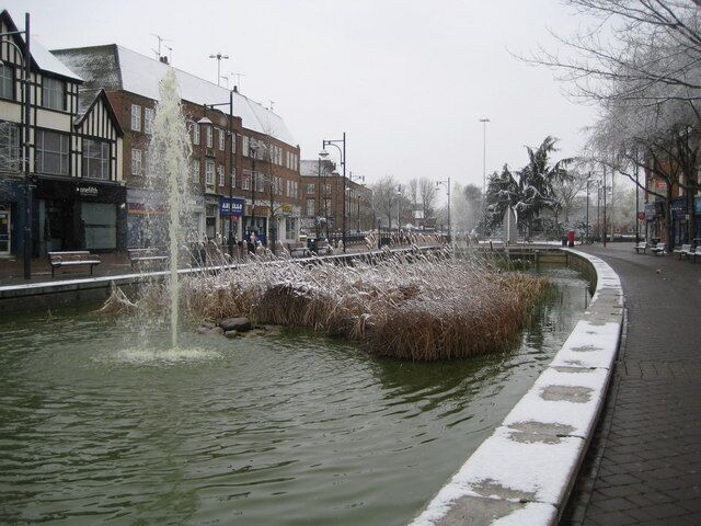 Watford: The Pond The water was a rather alarming pea-green soup colour contrasting with the whiteness of the snow on the roofs.
