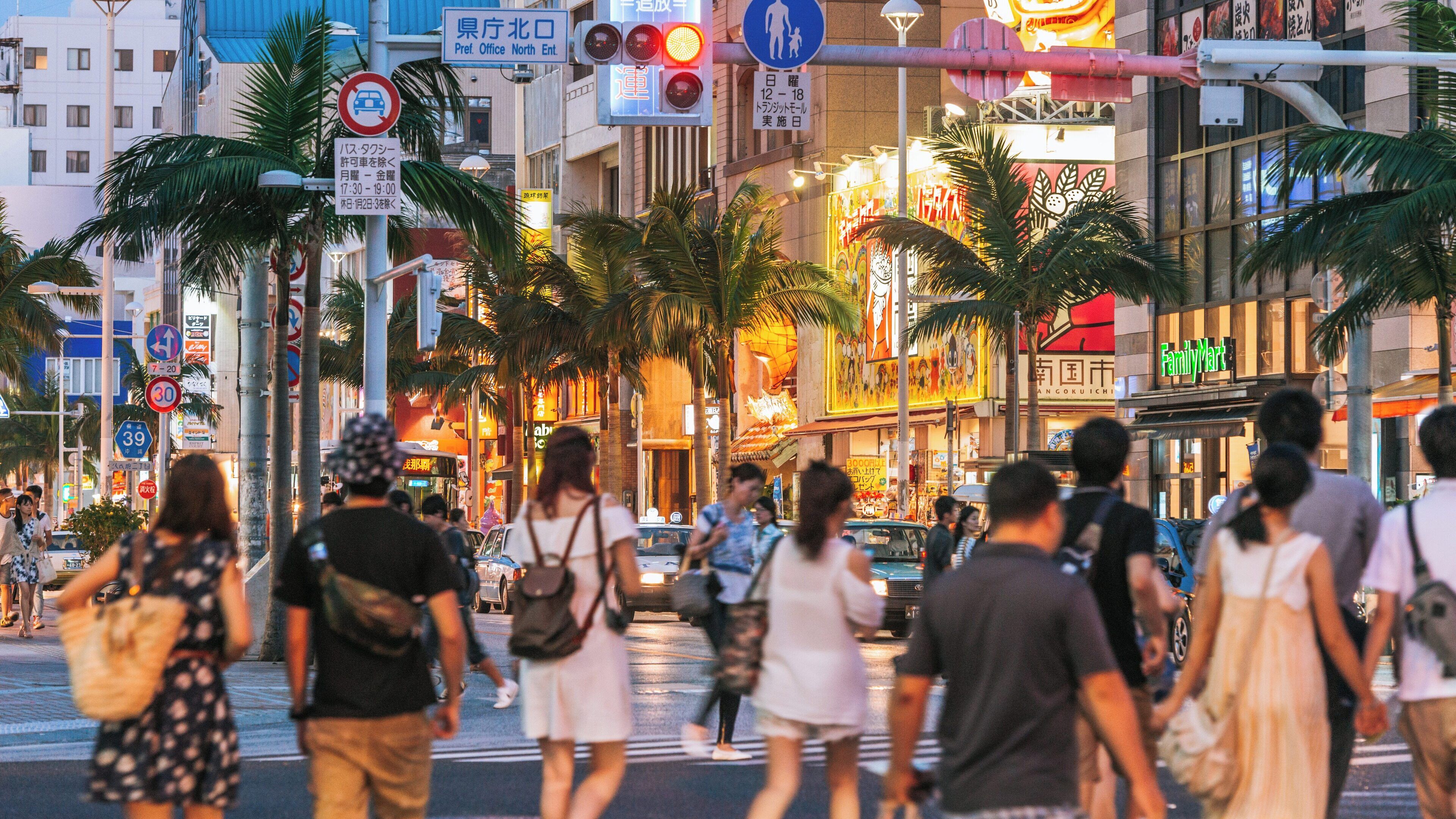 Vibrant nightlife at Kokusai Dori in Naha City, Okinawa, showcasing bustling streets and lively pedestrians
