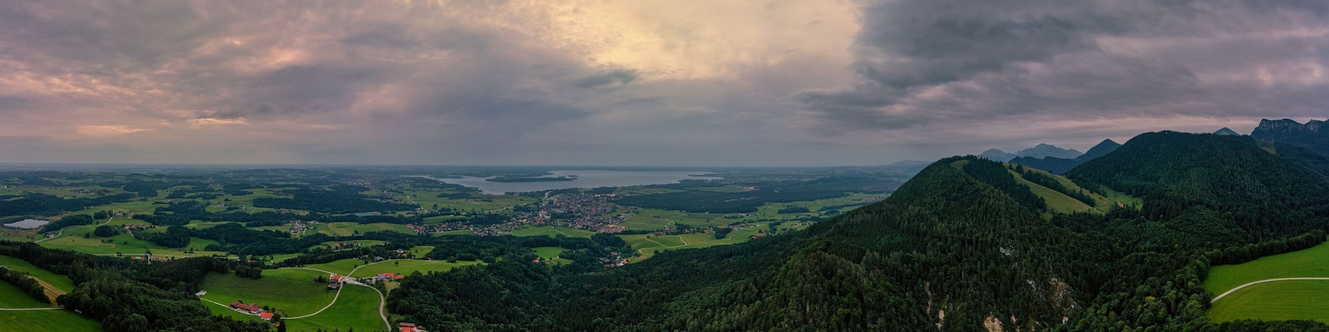 Aerial view over the Chiemsee with the view to the big, idyllic bavarian lake and the view over Bernau am Chiemsee.