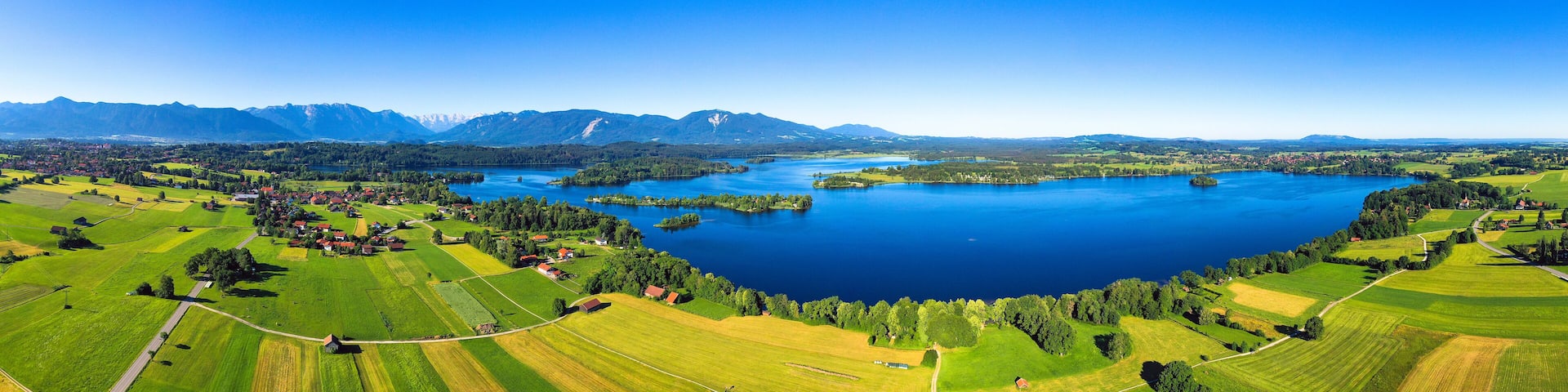 Panoramic view of Seehausen against clear blue sky Bavarian Alps in Germany