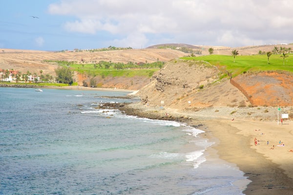 Meloneras Beach which includes a sandy beach and general coastal views