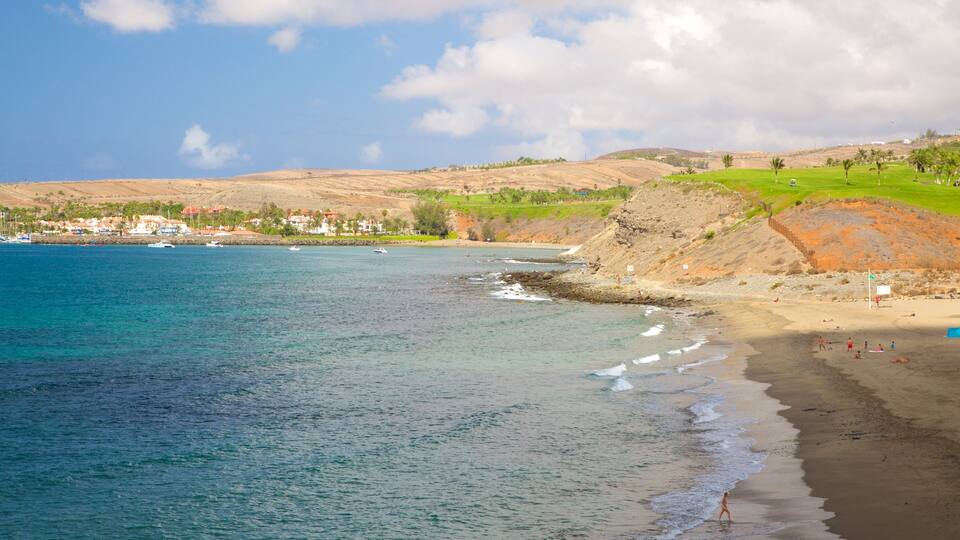 Meloneras-stranden som viser strand og kyst