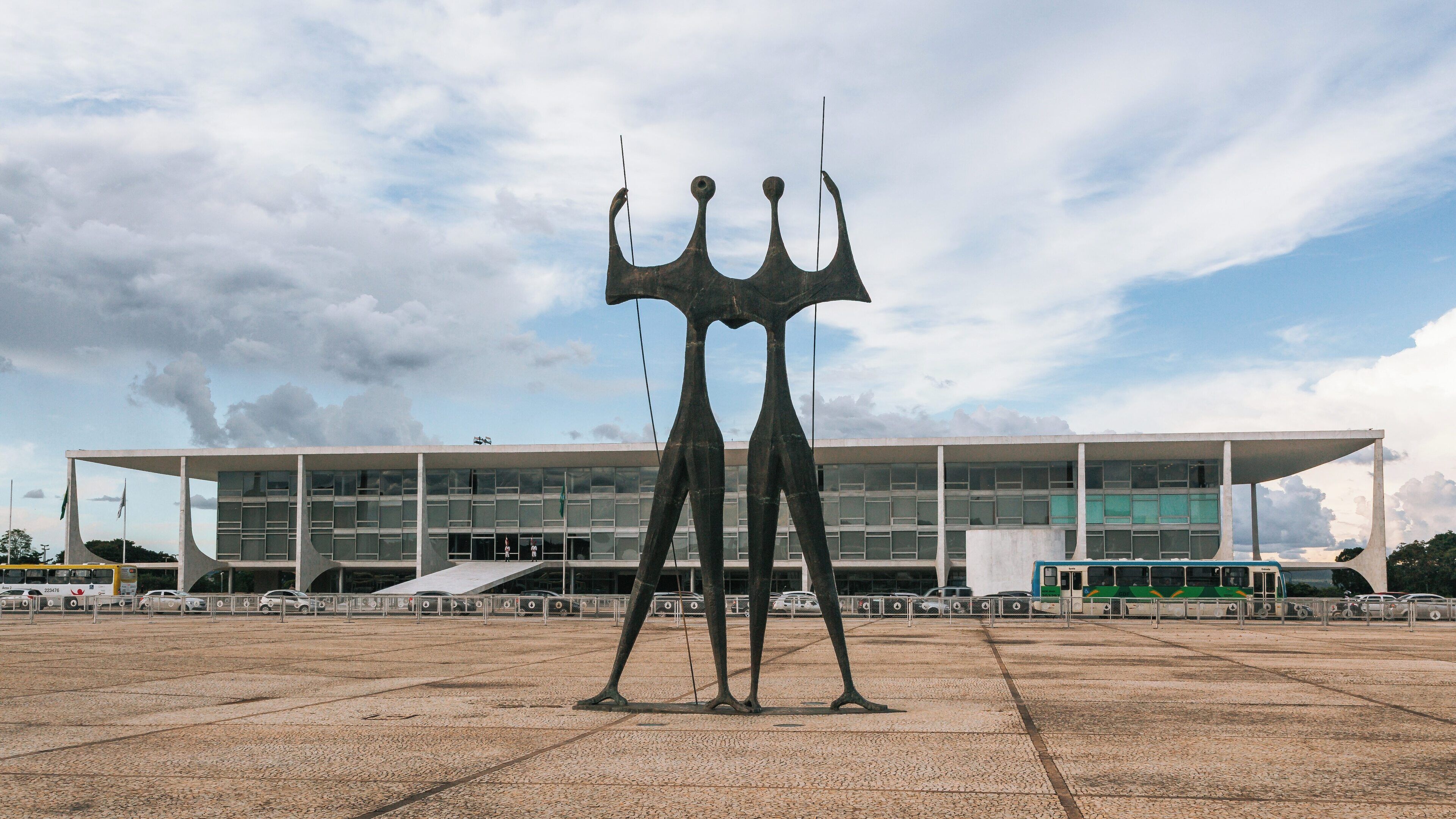 Square of the Three Powers showcases modern architecture and iconic sculpture in Brasília, Brazil under a cloudy sky