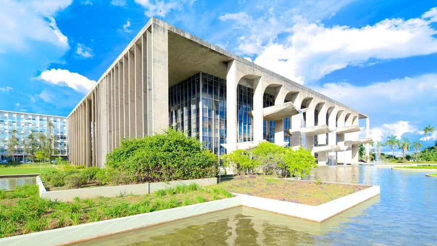 Palace of Justice showing a pond, modern architecture and a city