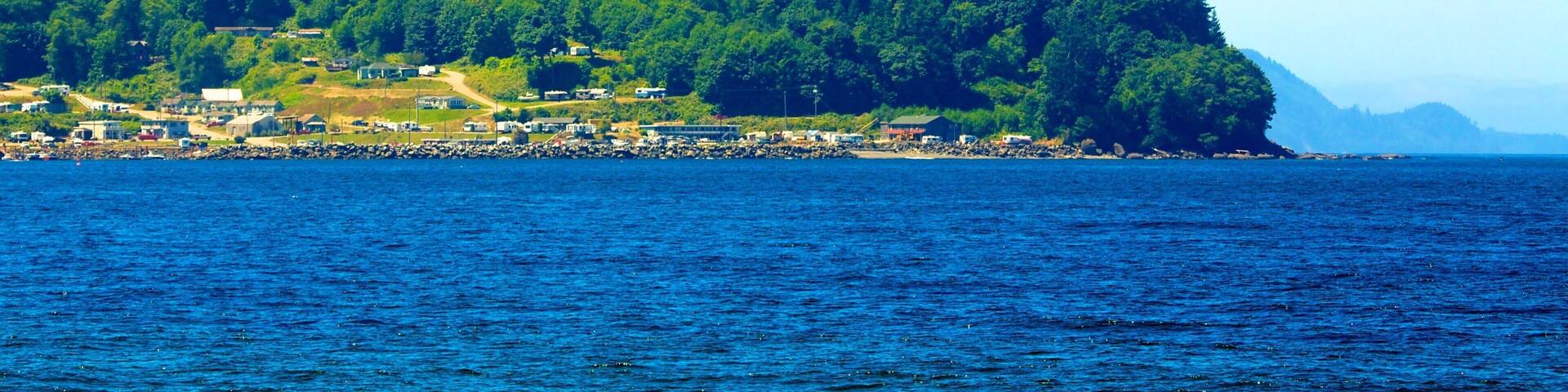 Clallam Bay featuring forests, a coastal town and general coastal views