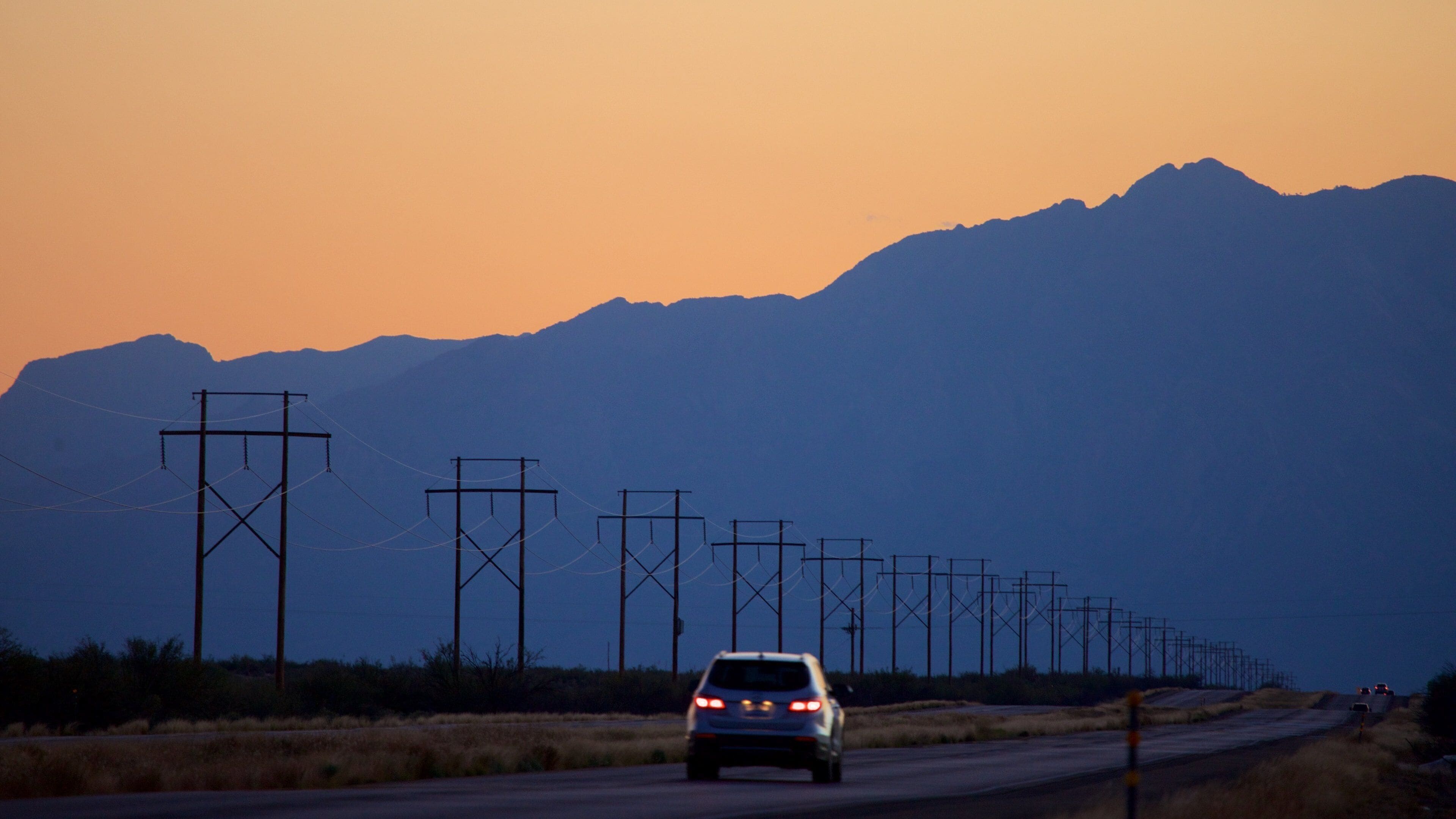 White Sands Missile Range Museum showing touring, mountains and a sunset