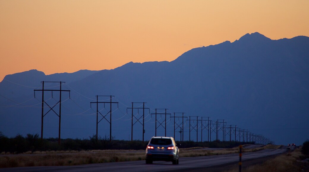 White Sands Missile Range Museum showing touring, mountains and a sunset