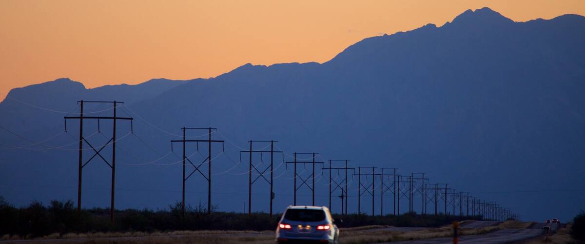 White Sands Missile Range Museum showing touring, mountains and a sunset