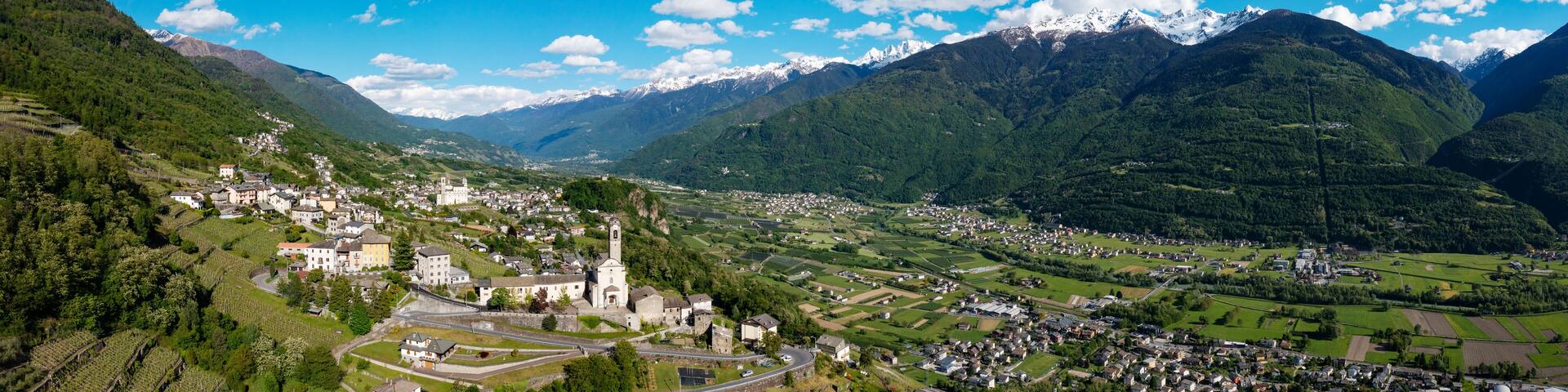 aerial view of the village of Poggiridenti and the church of San Fedele in Valtellina, Italy