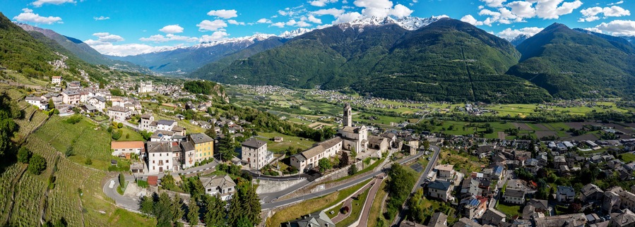 aerial view of the village of Poggiridenti and the church of San Fedele in Valtellina, Italy