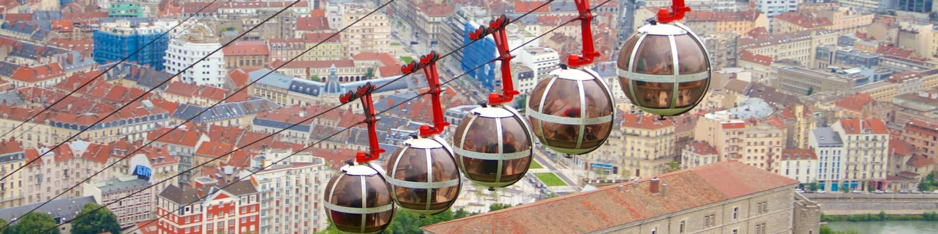 Grenoble-Bastille Cable Car showing a gondola and a city