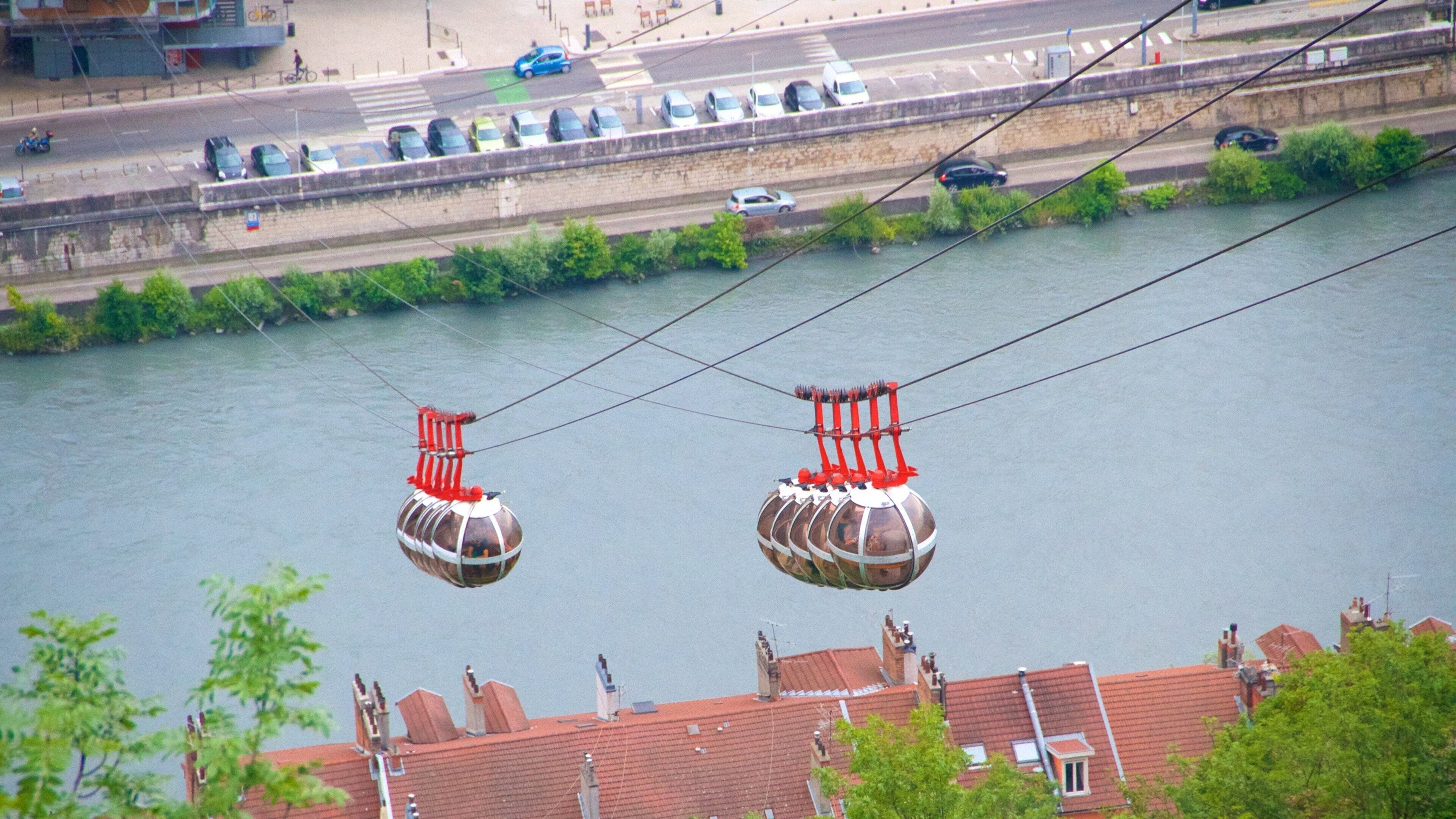 Grenoble-Bastille Cable Car featuring a gondola and a river or creek