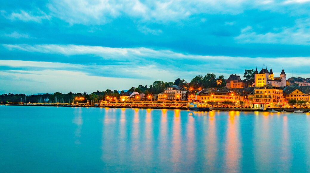 Sunset view of a white Palace in Nyon overlooking the Geneva lake in Switzerland