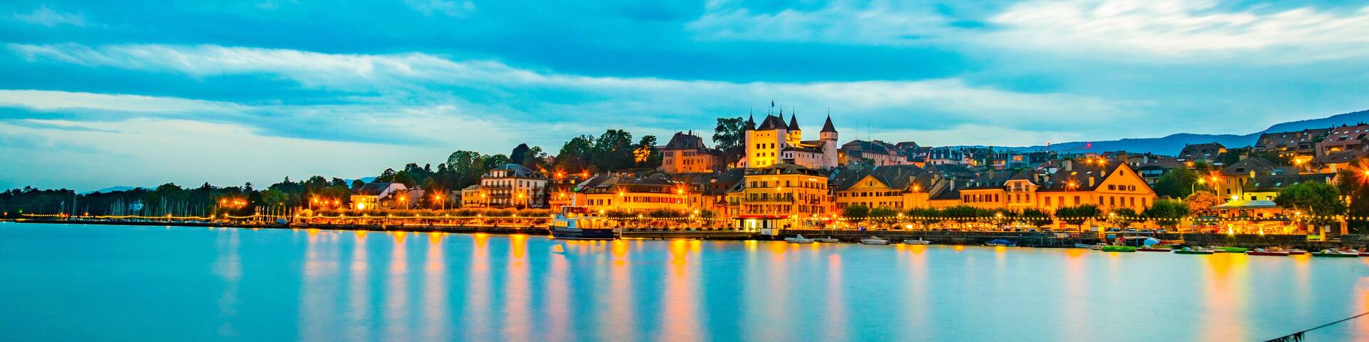 Sunset view of a white Palace in Nyon overlooking the Geneva lake in Switzerland