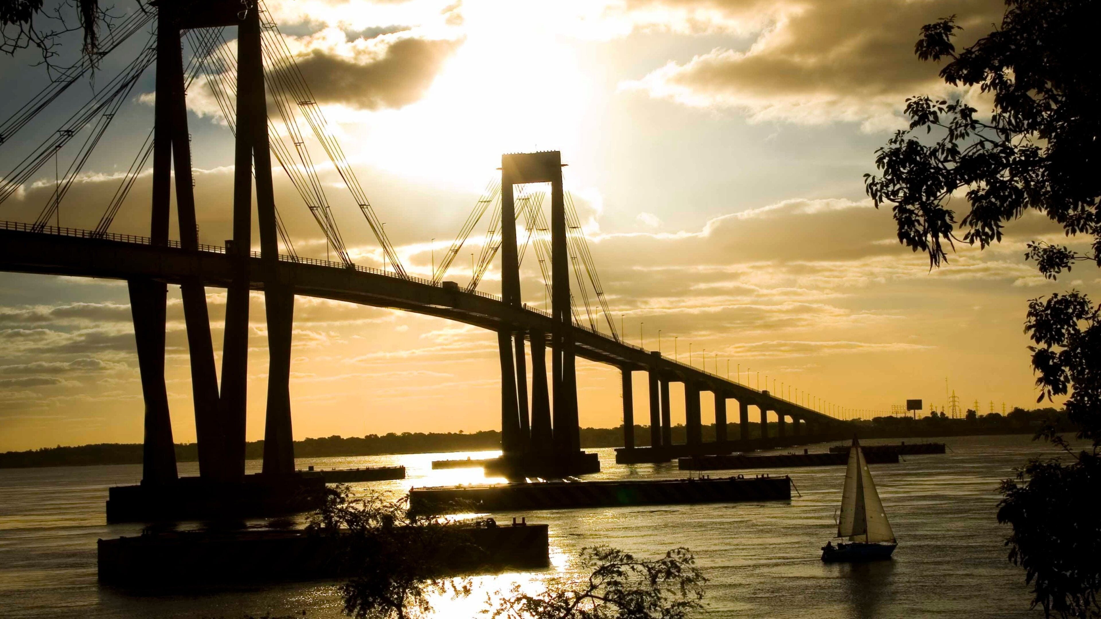 Chaco showing a bridge, general coastal views and a sunset