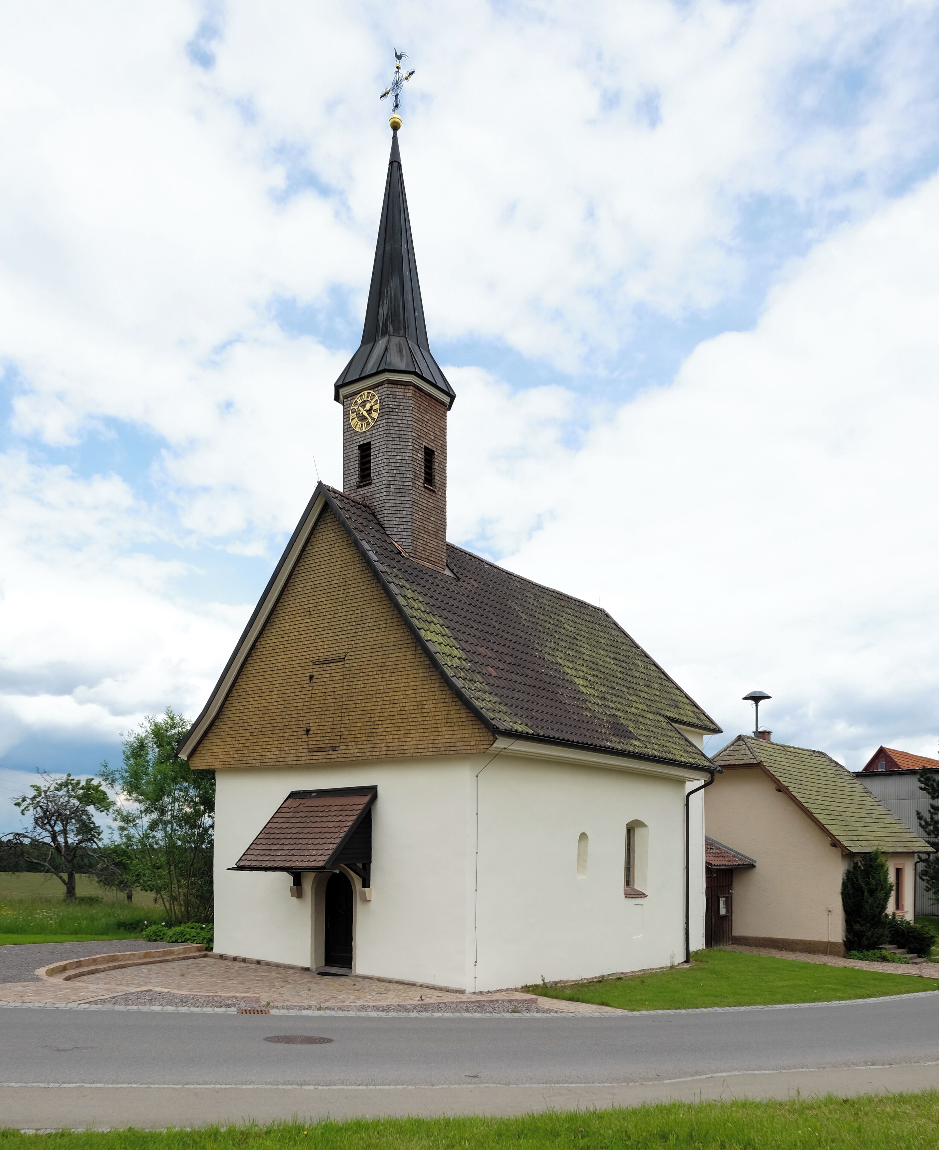 A church with a steeple and clock tower.