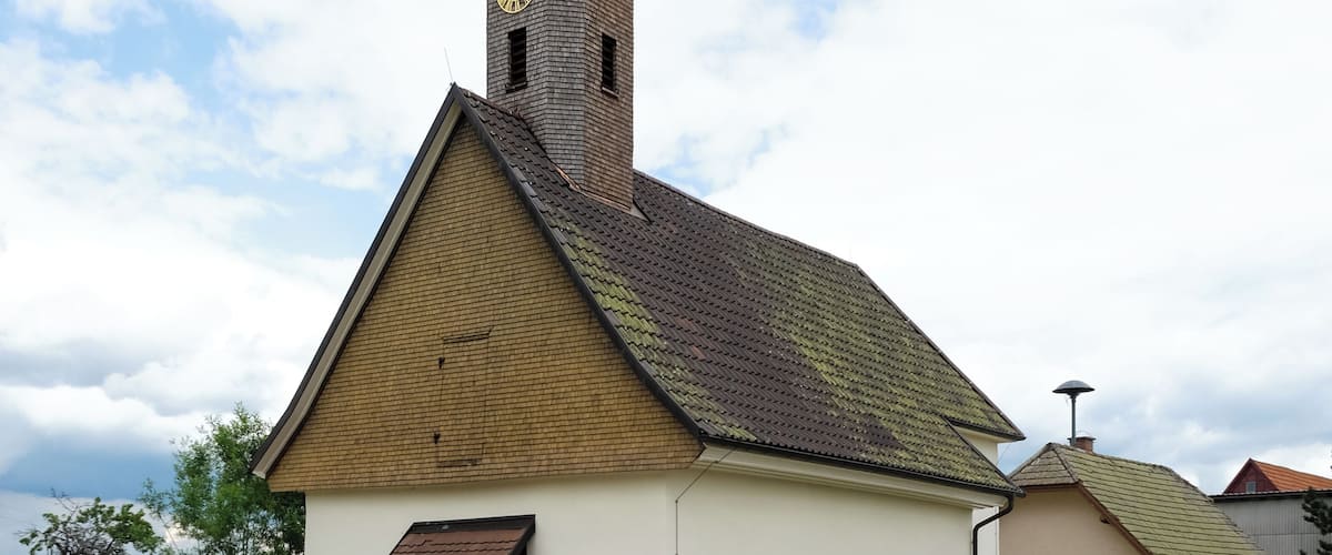 A church with a steeple and clock tower.
