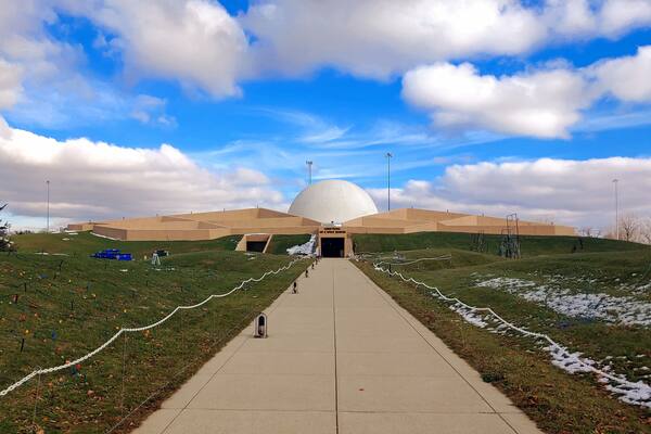 A shot at distance of the unique architecture of the Armstrong Air & Space Museum.
Earth was mounded around the steel-reinforced concrete building, giving the building the semblance of being underground. Designed to accommodate the Astro Theater for multimedia film and sound presentations, the central sphere dominates the entire complex. The fifty-six feet wide dome enhances the futuristic moon-base design.
#Trovember