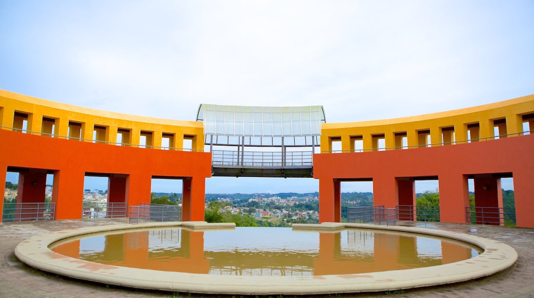 Tangua Park featuring modern architecture and a pond