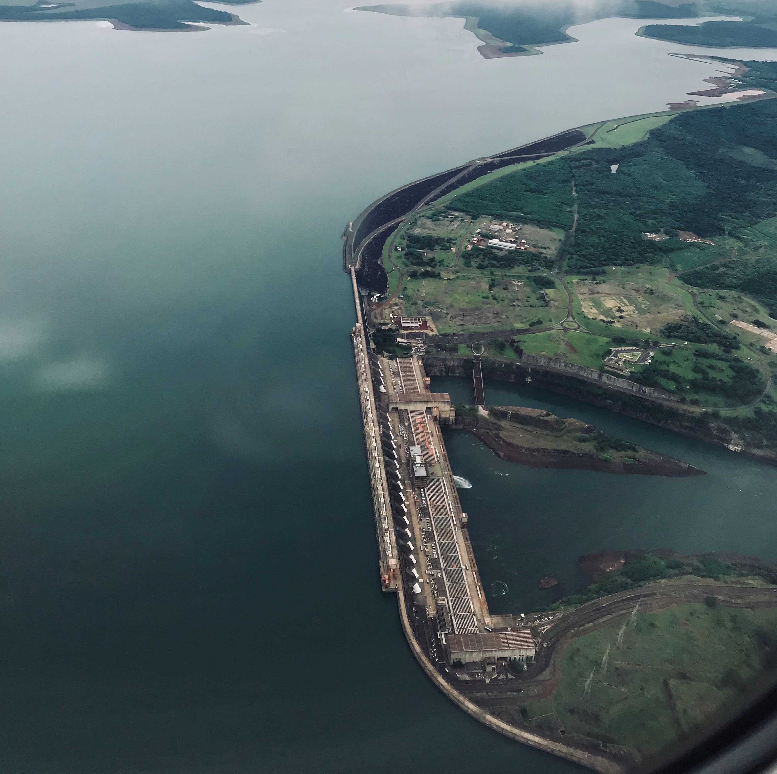 A large dam with a long spillway and a lock system.