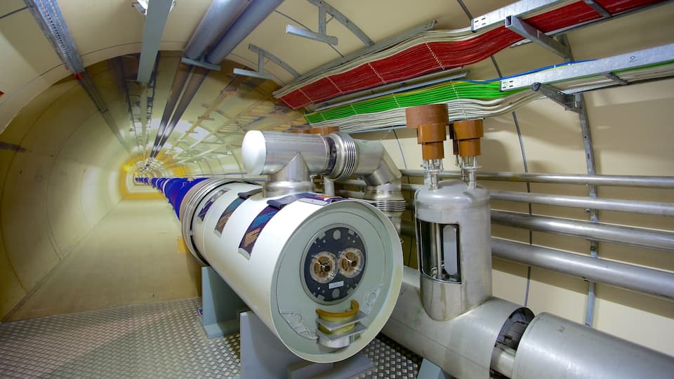 A large industrial machine with a cylindrical component and multiple pipes.