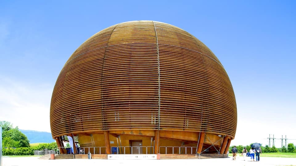 A large, wooden, spherical building with horizontal slats.