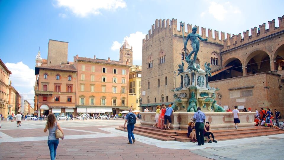 A historic square with a prominent fountain and a large brick building with battlements.