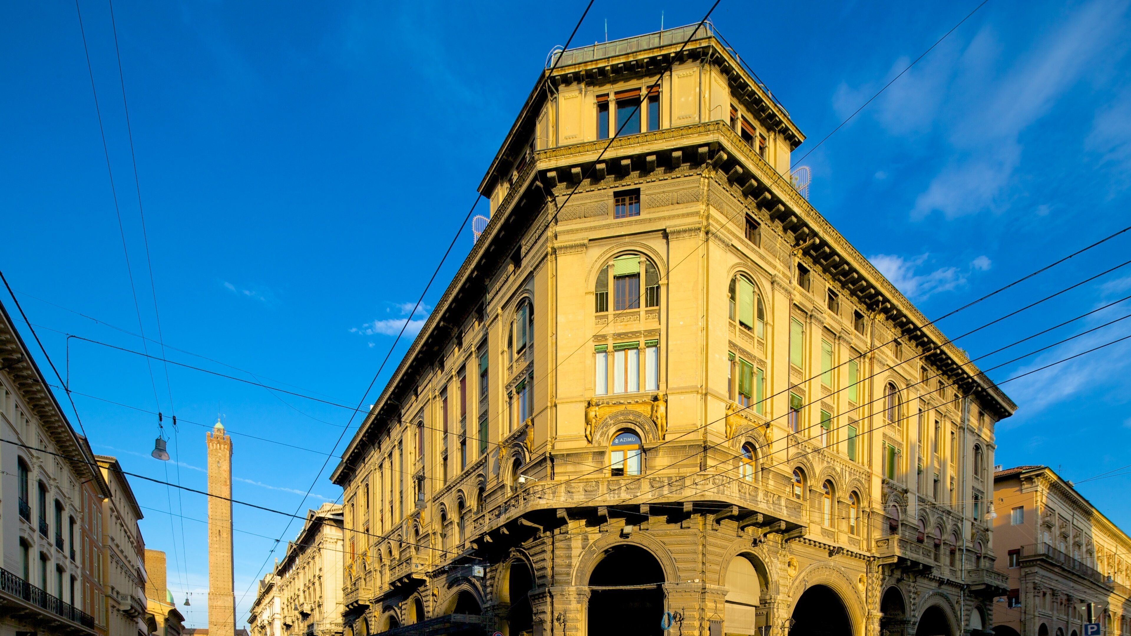 A historic building with ornate architecture and a clear blue sky.
