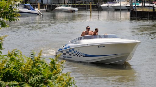 Southern Ontario featuring boating and a bay or harbor as well as a small group of people